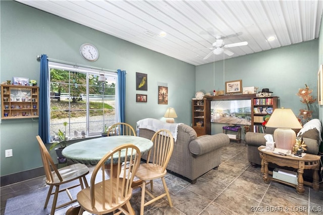 interior space with ceiling fan