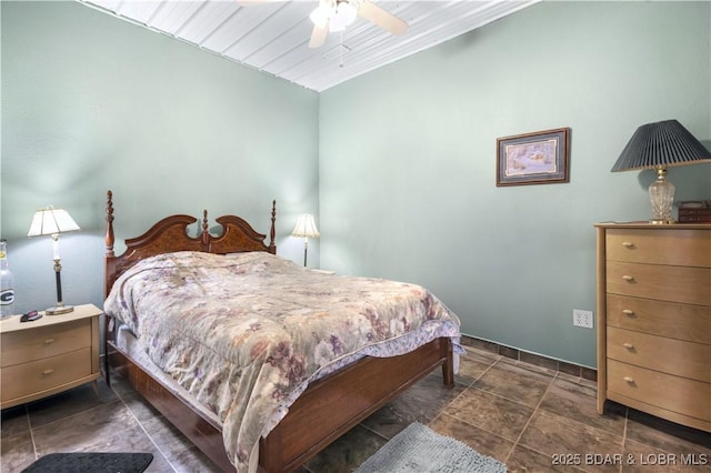 bedroom featuring ceiling fan and baseboards