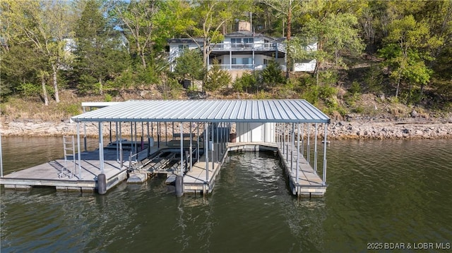 view of dock with a water view and boat lift