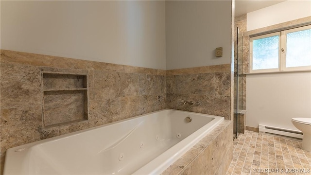 full bathroom featuring toilet, a baseboard heating unit, and a whirlpool tub