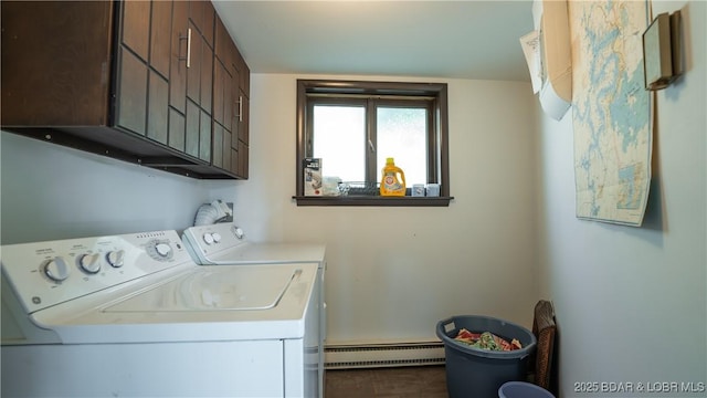 washroom featuring baseboard heating, cabinet space, and separate washer and dryer