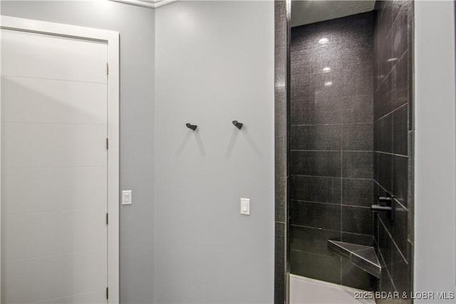 bathroom featuring tiled shower