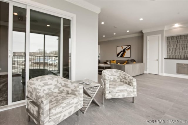 living area featuring recessed lighting, baseboards, and ornamental molding