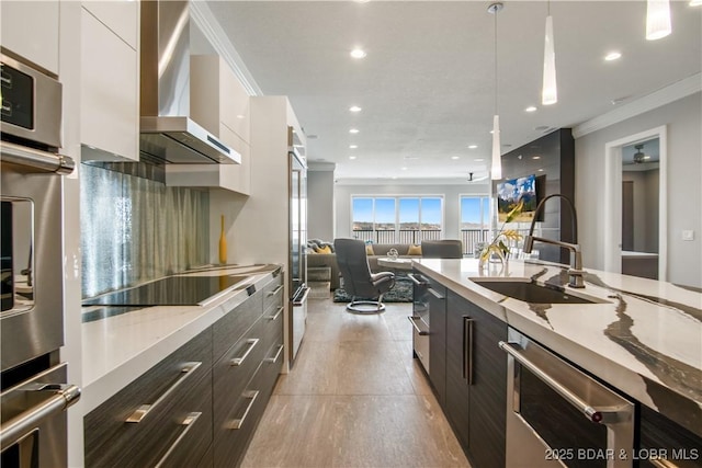 kitchen featuring black electric stovetop, dishwashing machine, modern cabinets, wall chimney exhaust hood, and a sink