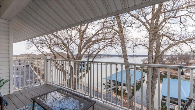 wooden terrace with a water view