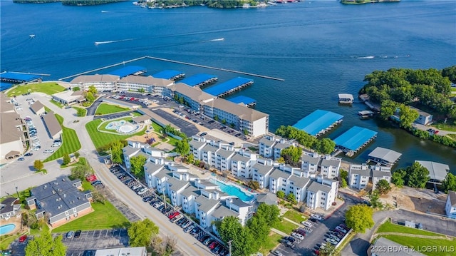 birds eye view of property with a water view