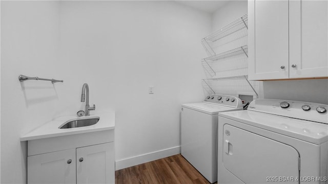 399 W End Cir, Osage Beach, MO 65065 - washroom featuring separate washer and dryer, cabinet space, and dark wood finished floors