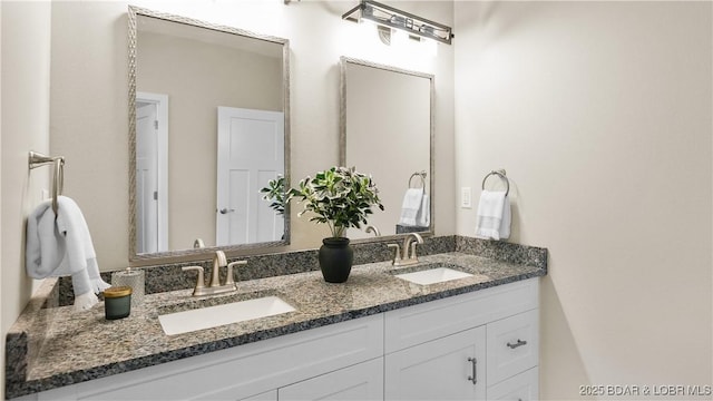 bathroom with double vanity and a sink