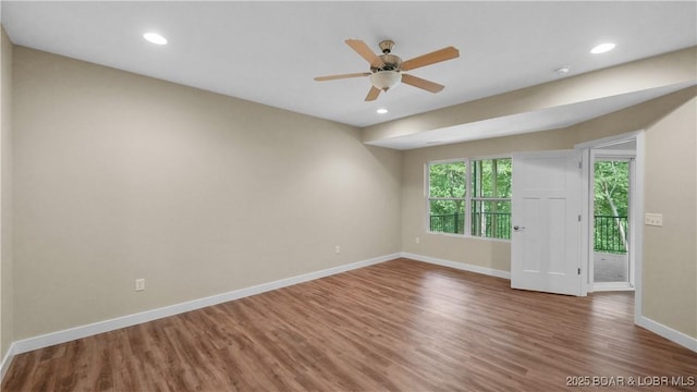 unfurnished room with ceiling fan, recessed lighting, wood finished floors, and baseboards