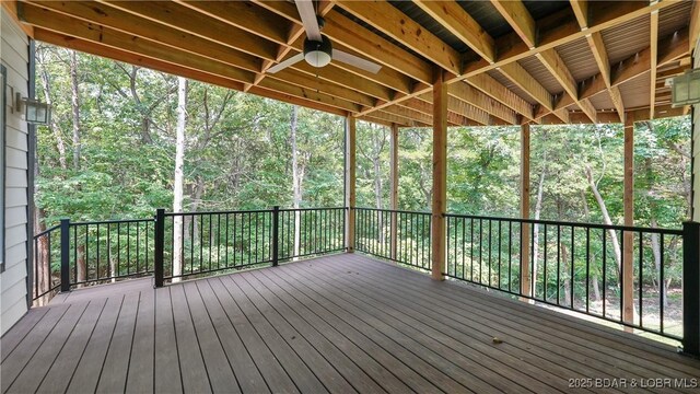 399 W End Cir, Osage Beach, MO 65065 - deck featuring a ceiling fan and a wooded view