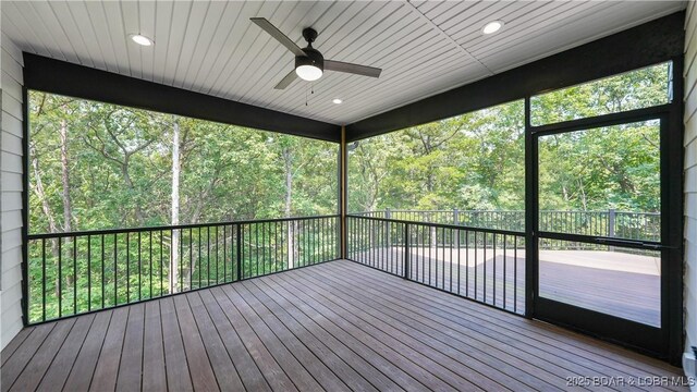 399 W End Cir, Osage Beach, MO 65065 - wooden terrace with a ceiling fan and a wooded view