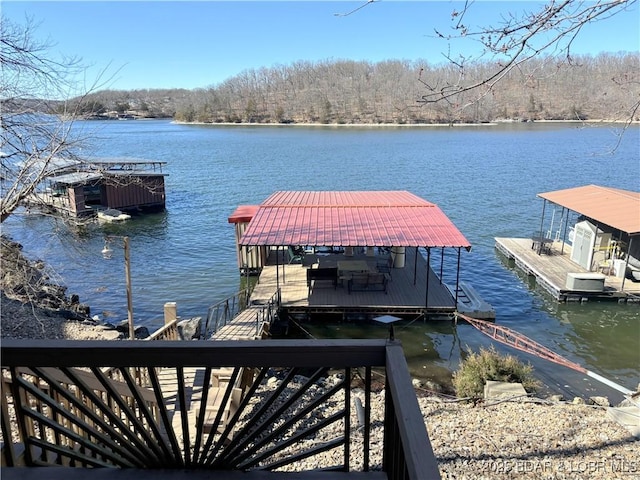 view of dock featuring a water view and boat lift