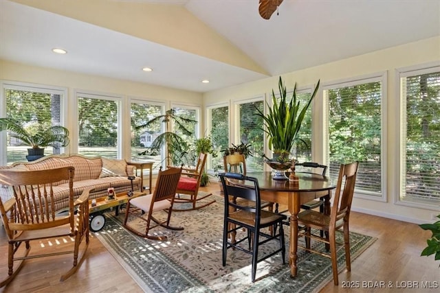 sunroom featuring a ceiling fan and lofted ceiling