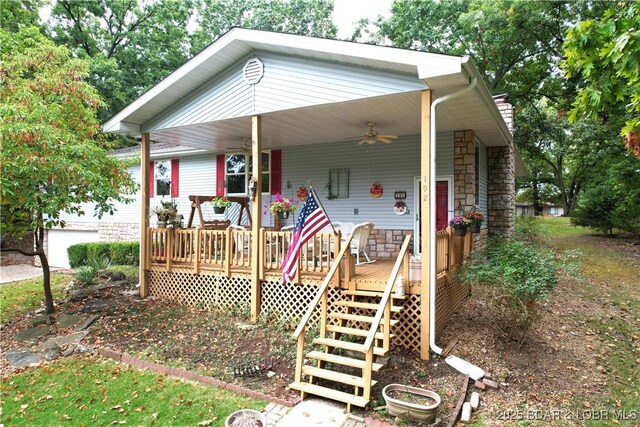 192 Mayfair Dr, Camdenton, MO 65020 - manufactured / mobile home featuring stone siding, a ceiling fan, and covered porch