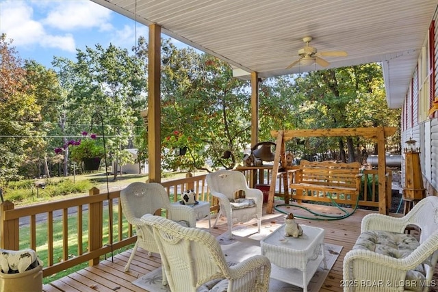 wooden deck featuring ceiling fan