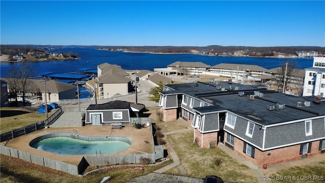 aerial view with a residential view and a water view