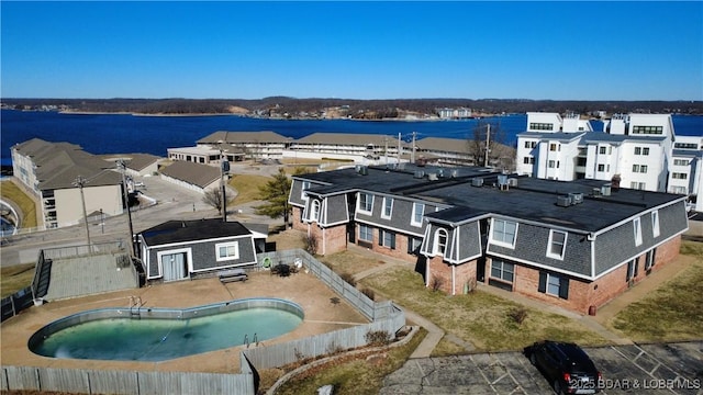 birds eye view of property featuring a water view