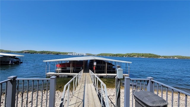 view of dock featuring a water view and boat lift