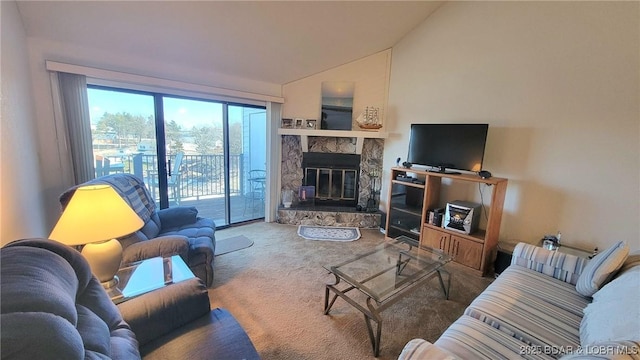 carpeted living room featuring a fireplace and vaulted ceiling