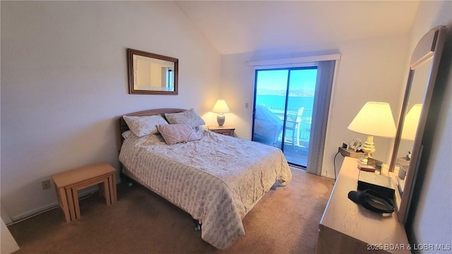 bedroom featuring access to exterior, carpet, and vaulted ceiling