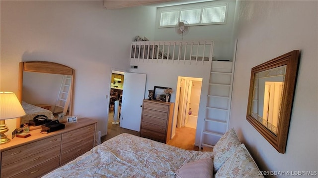 bedroom featuring a towering ceiling