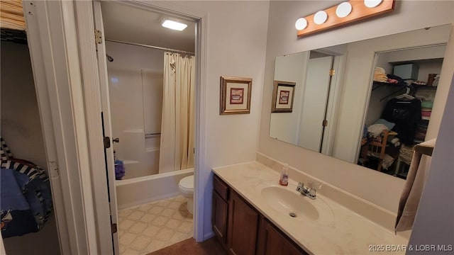 bathroom with toilet, shower / bath combination with curtain, vanity, and tile patterned floors