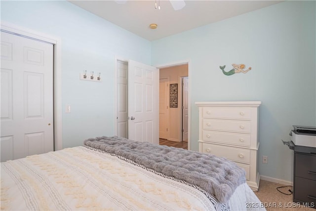 bedroom with baseboards and a ceiling fan