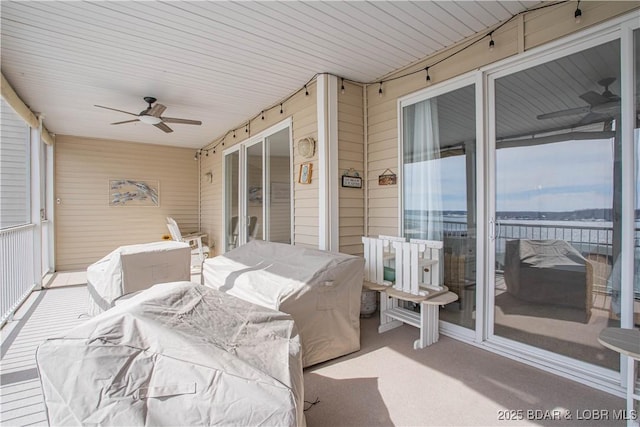 sunroom with a ceiling fan