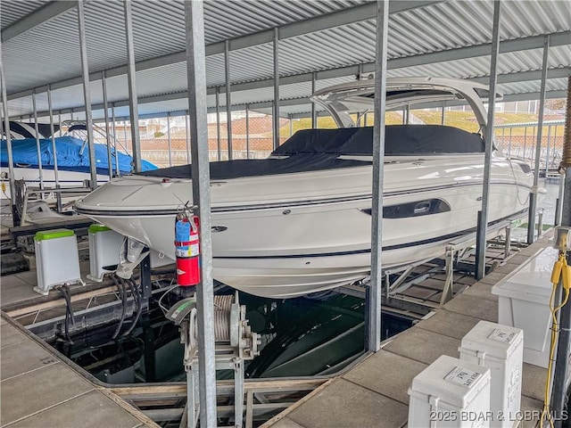 view of dock with boat lift