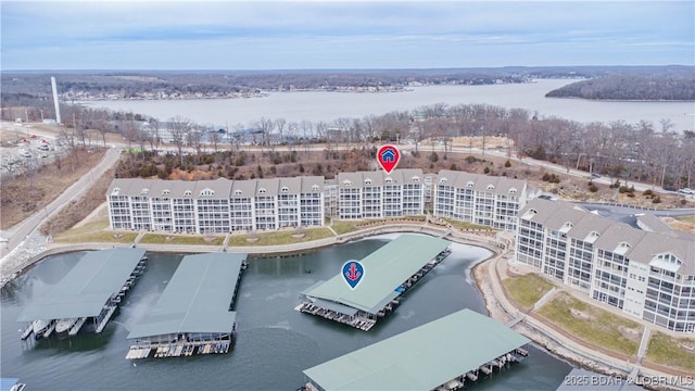 birds eye view of property with a water view