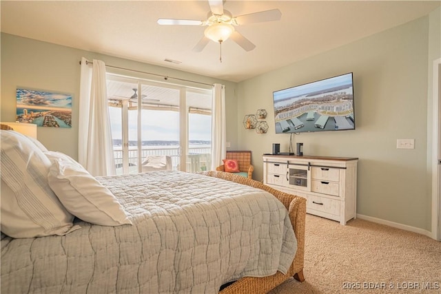 bedroom featuring light carpet, visible vents, baseboards, a ceiling fan, and access to outside