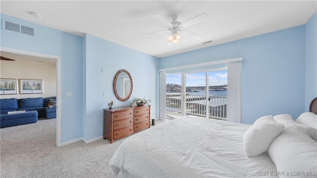 carpeted bedroom with a ceiling fan, access to outside, visible vents, and baseboards