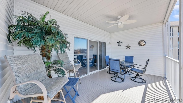 sunroom / solarium with ceiling fan and a wealth of natural light