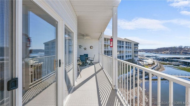 balcony featuring a water view