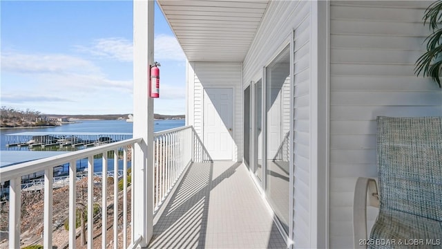 balcony featuring a water view