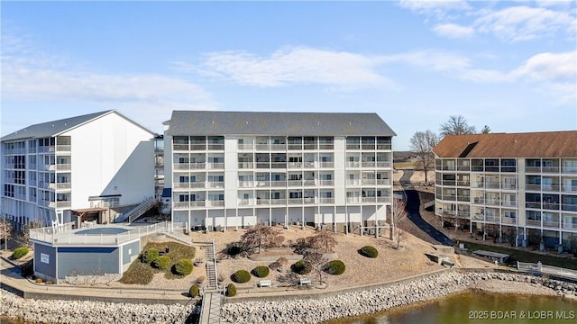 view of building exterior with a water view