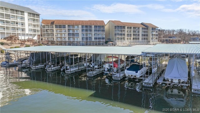 dock area with a water view and boat lift