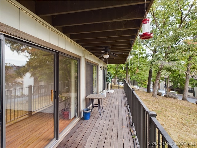 wooden terrace with a ceiling fan