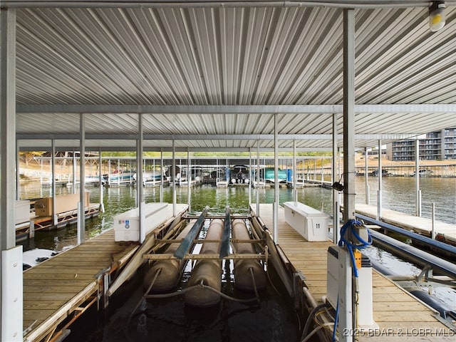 view of dock featuring a water view and boat lift