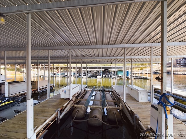 dock area featuring a water view and boat lift