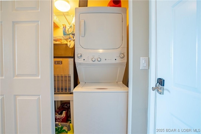 laundry area with laundry area and stacked washer and clothes dryer