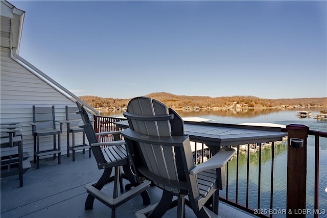 balcony featuring a water view