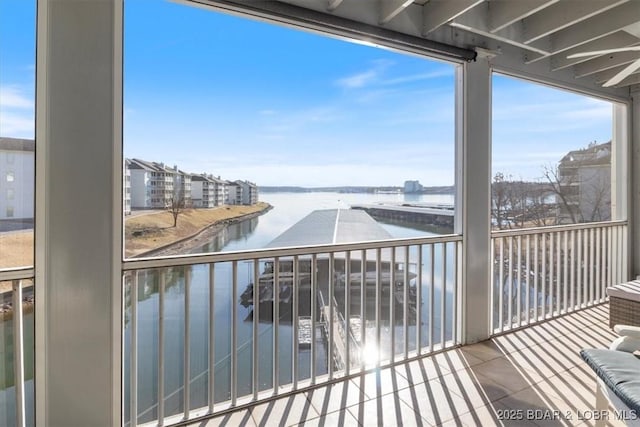 balcony featuring a water view