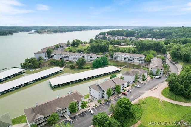 birds eye view of property featuring a water view