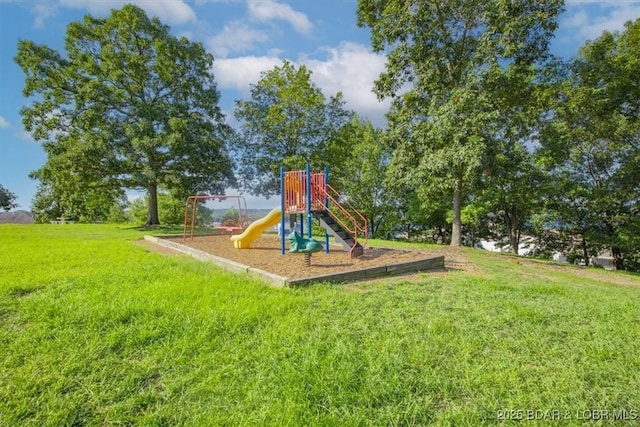 community jungle gym with a lawn