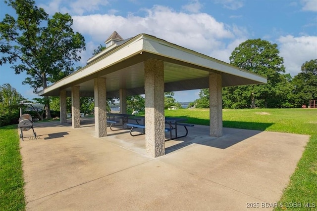 surrounding community with a gazebo, a yard, and a patio