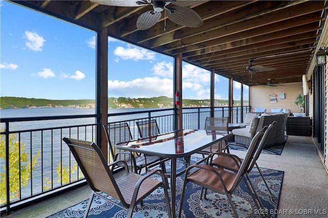 view of patio / terrace with an outdoor hangout area, outdoor dining area, a water view, and a balcony