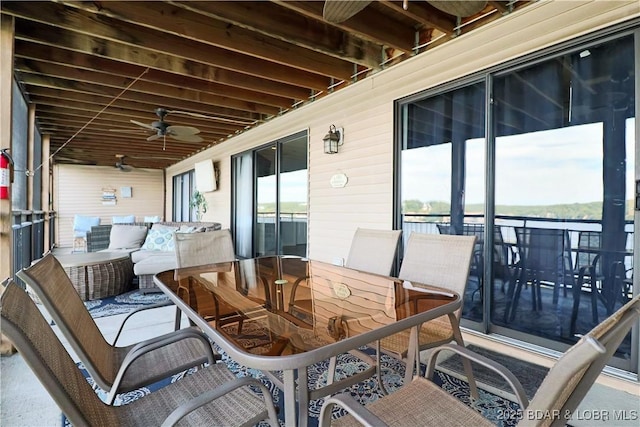 exterior space with outdoor dining area, ceiling fan, and an outdoor hangout area