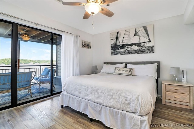 bedroom featuring access to exterior, ceiling fan, and wood finished floors