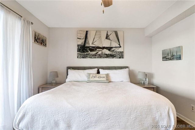 bedroom featuring ceiling fan and baseboards